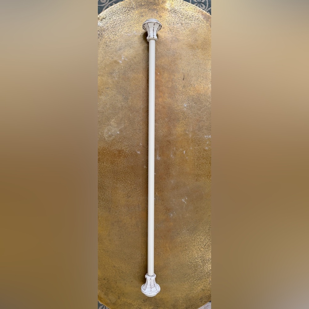 Extension curtain rod with hardware.